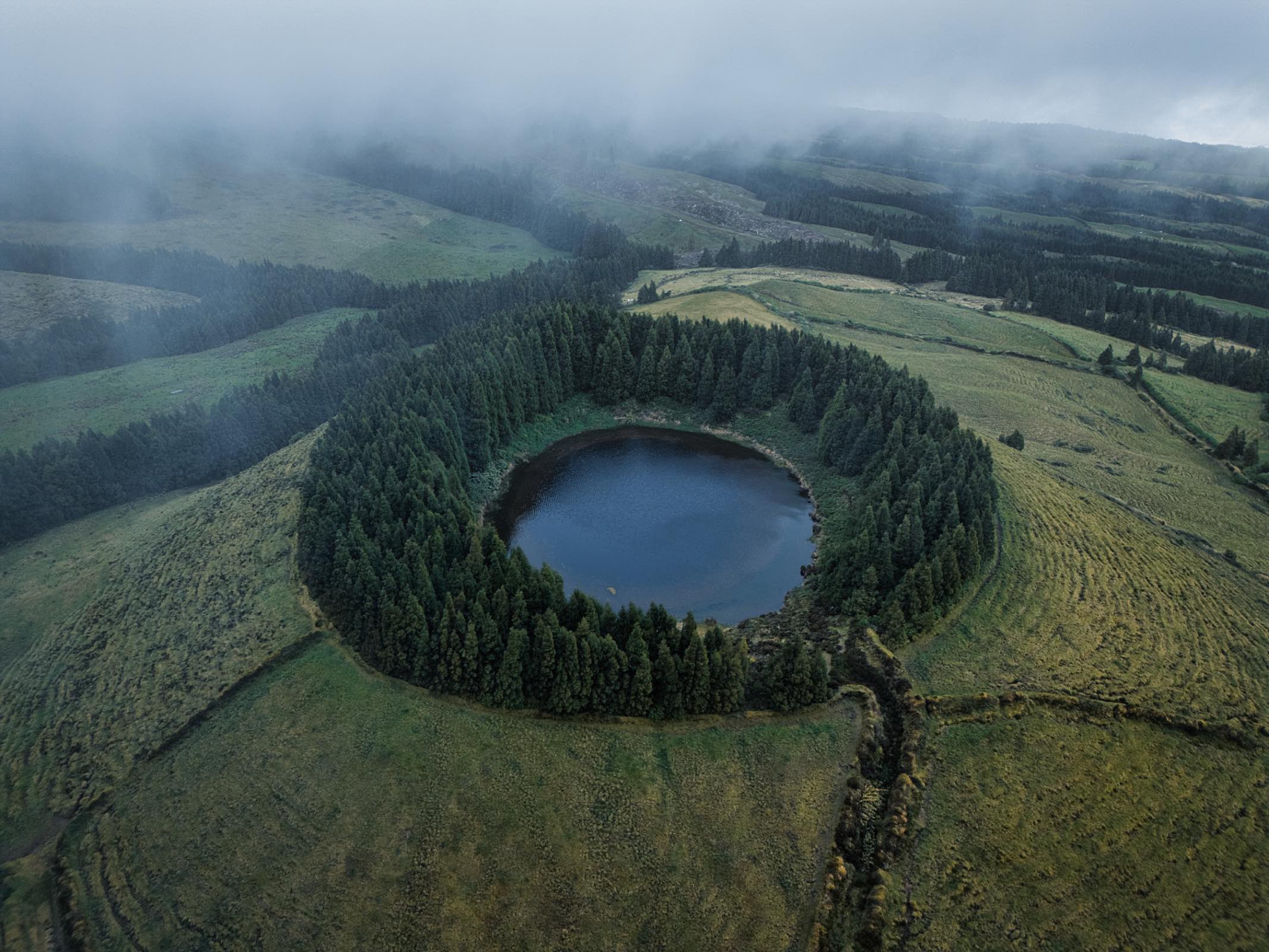 The "Lake Eye" is part of the volcanic crater of Sete Cidades, home to two interconnected lakes—Lagoa Azul and Lagoa Verde—each with its own distinct color.